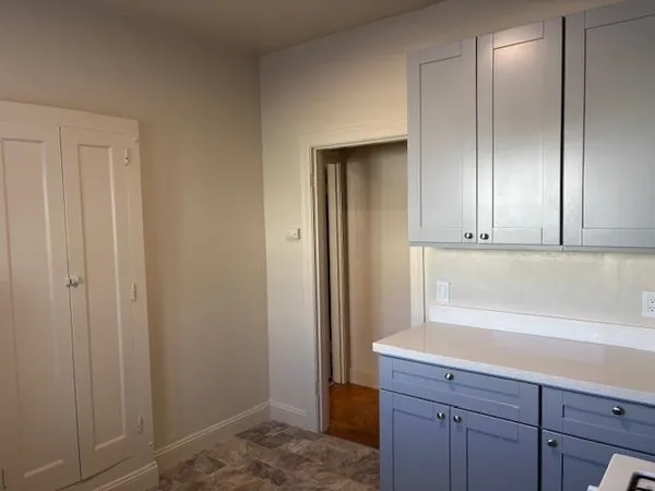a view of cabinets and wooden floor