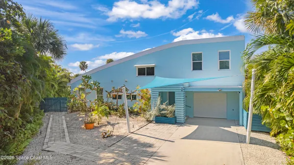 a view of a patio with table and chairs and potted plants