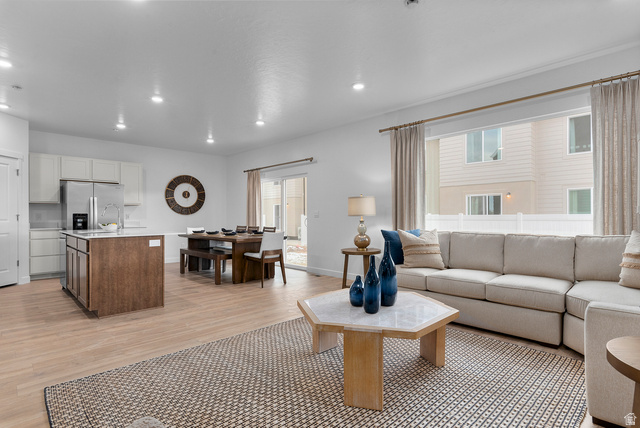 722 West 2840 South, Unit 8 Logan, UT 84321 - Photo 11 of 23 Living room featuring recessed lighting and light wood-style flooring