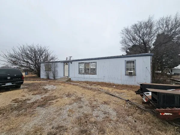a view of a house with a yard and garage
