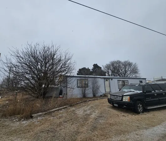a view of a car in front of house