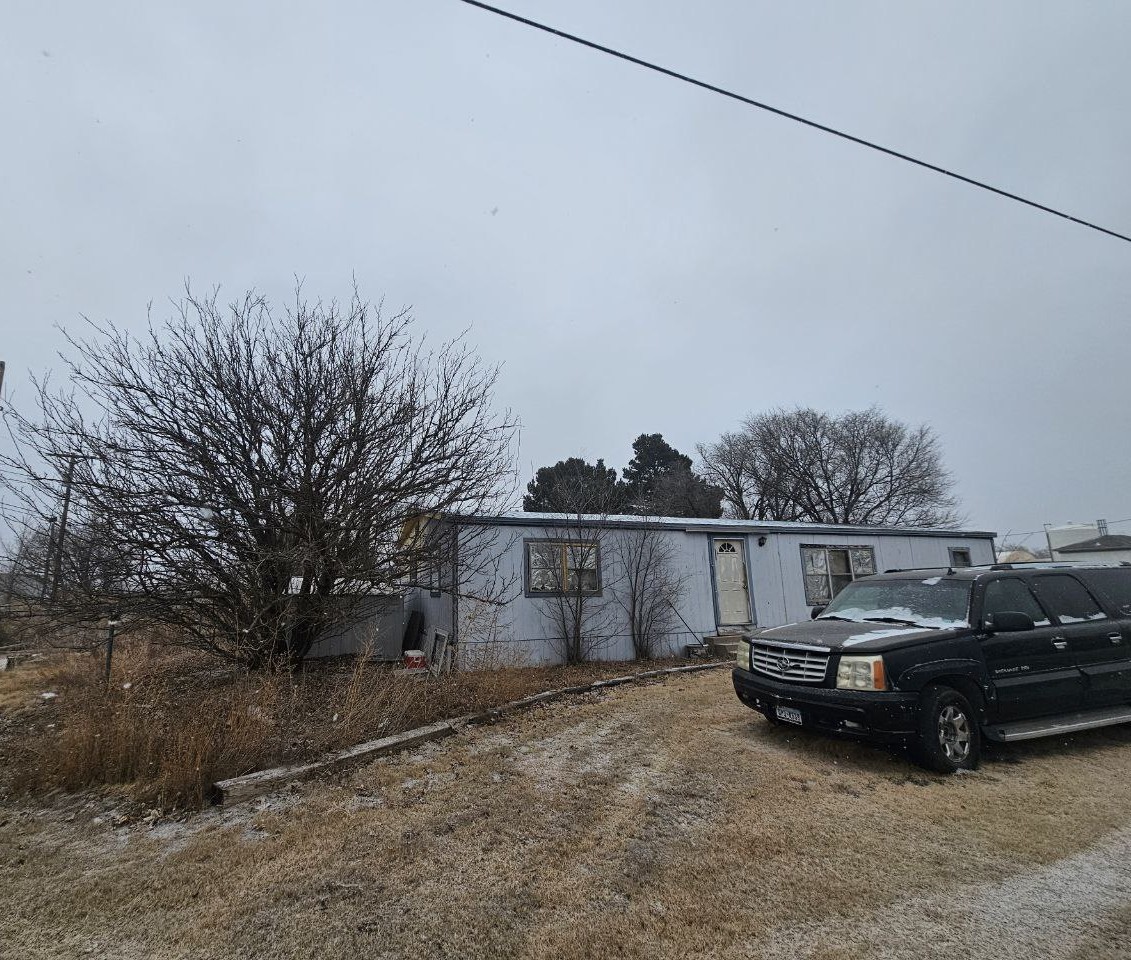 500 Ross Street Vega, TX 79092 - Photo 7 of 7 a view of a car in front of house