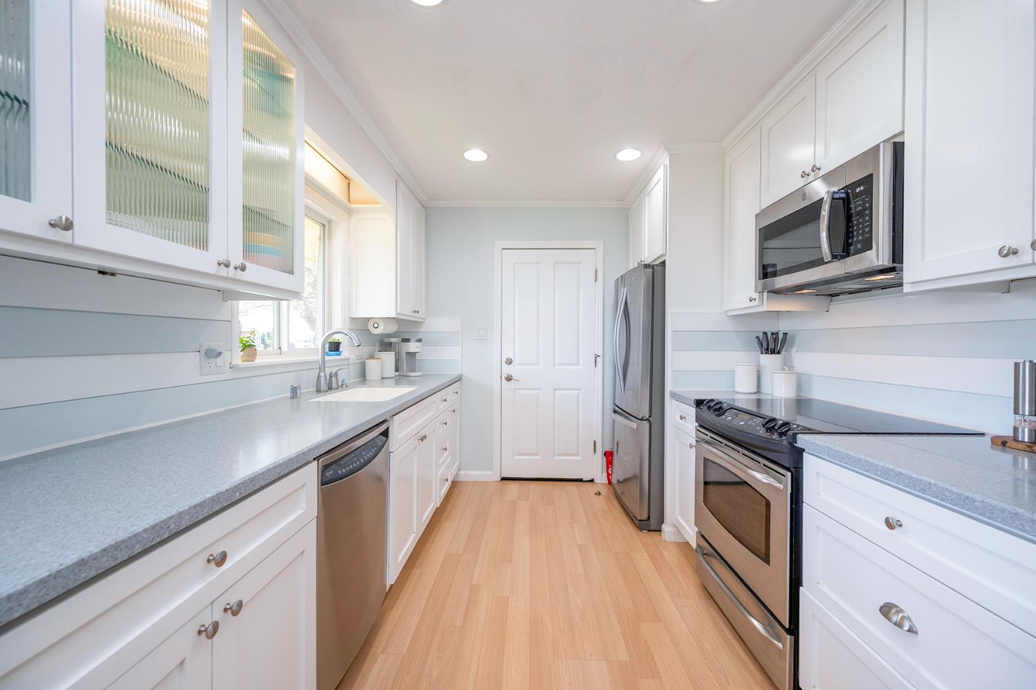 524 Williams Street Murphys, CA 95247 - Photo 13 of 64 a kitchen with stainless steel appliances a stove a sink and a refrigerator