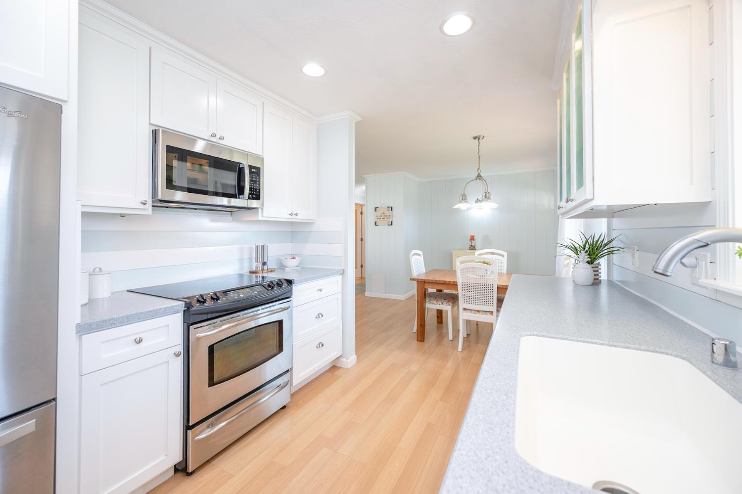 524 Williams Street Murphys, CA 95247 - Photo 17 of 64 a kitchen with stainless steel appliances a stove a sink a microwave and cabinets