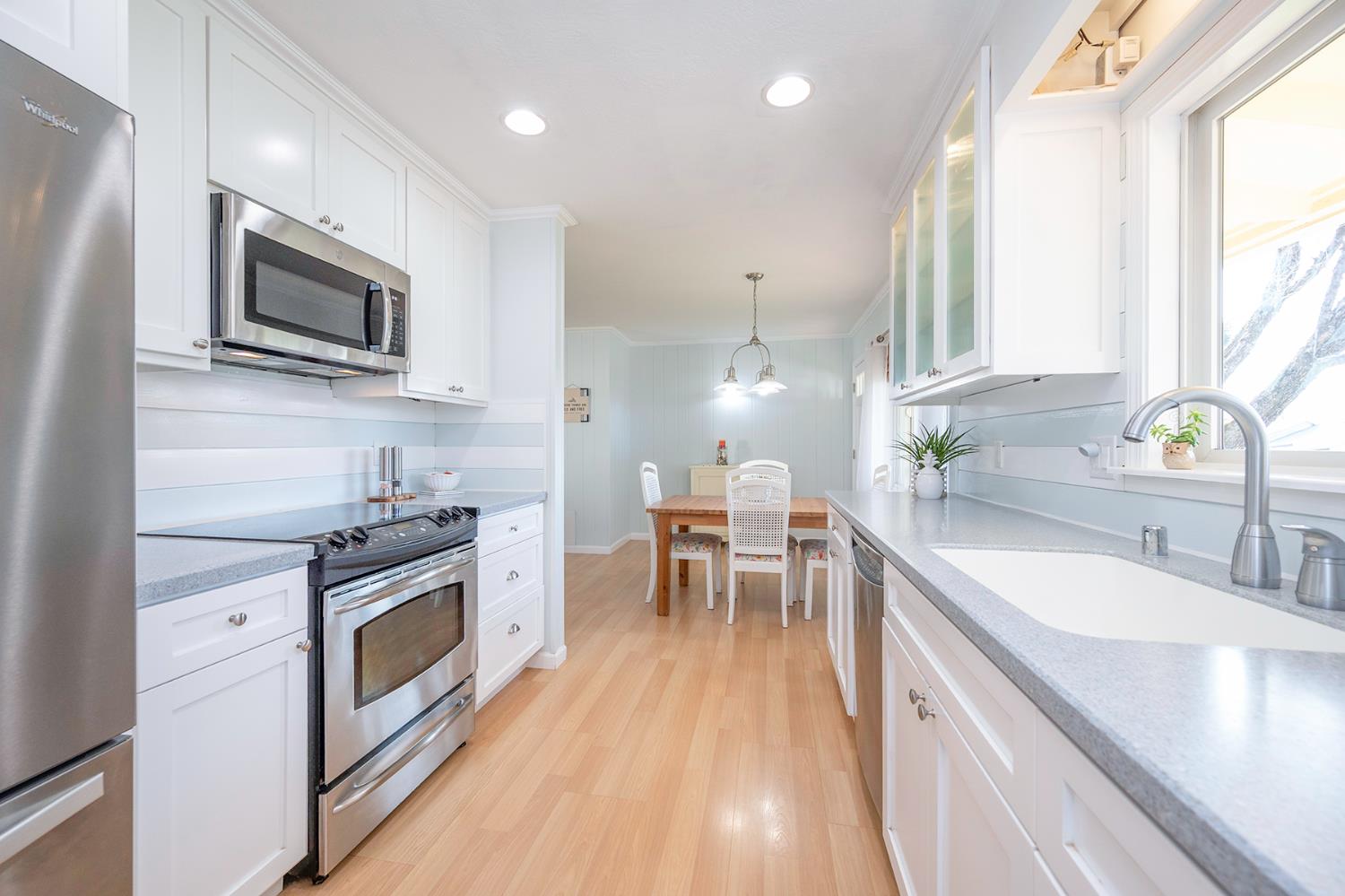 524 Williams Street Murphys, CA 95247 - Photo 18 of 64 a kitchen with stainless steel appliances granite countertop a sink stove and microwave