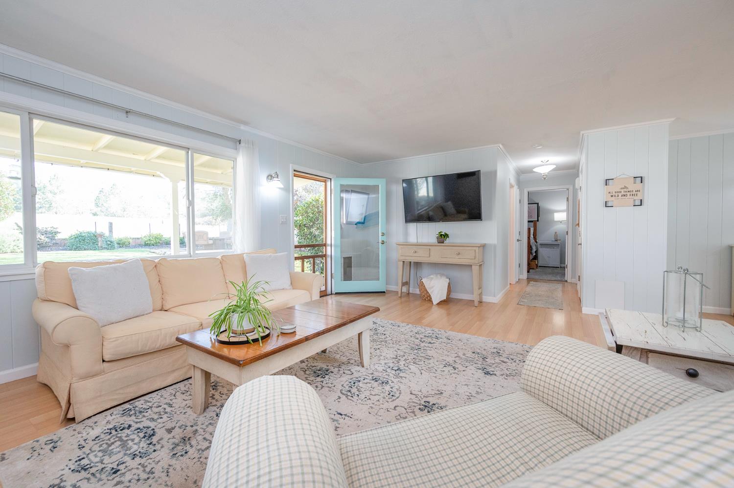 524 Williams Street Murphys, CA 95247 - Photo 23 of 64 a living room with furniture a fireplace and a flat screen tv