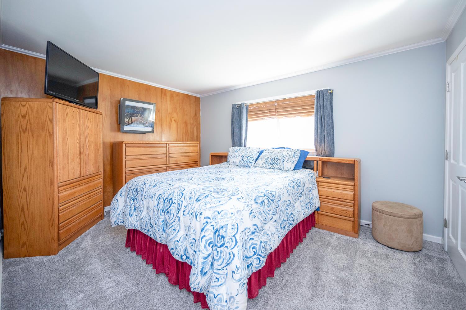 524 Williams Street Murphys, CA 95247 - Photo 28 of 64 a bedroom with a bed and a refrigerator