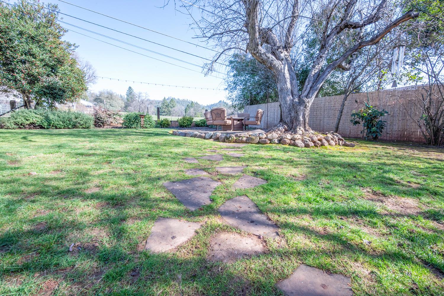 524 Williams Street Murphys, CA 95247 - Photo 40 of 64 a backyard of a house with table and chairs