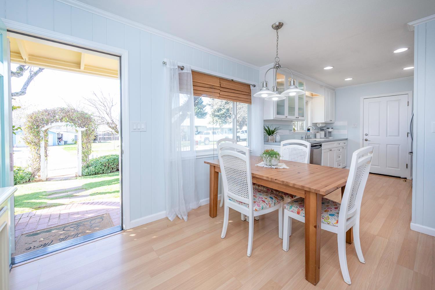524 Williams Street Murphys, CA 95247 - Photo 8 of 64 a dining room with furniture large windows and a chandelier