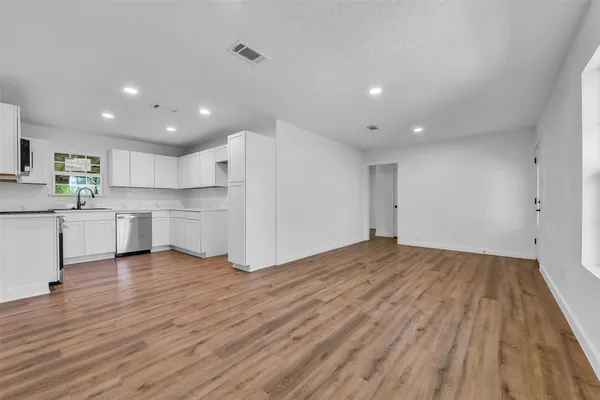 a view of kitchen with wooden floor