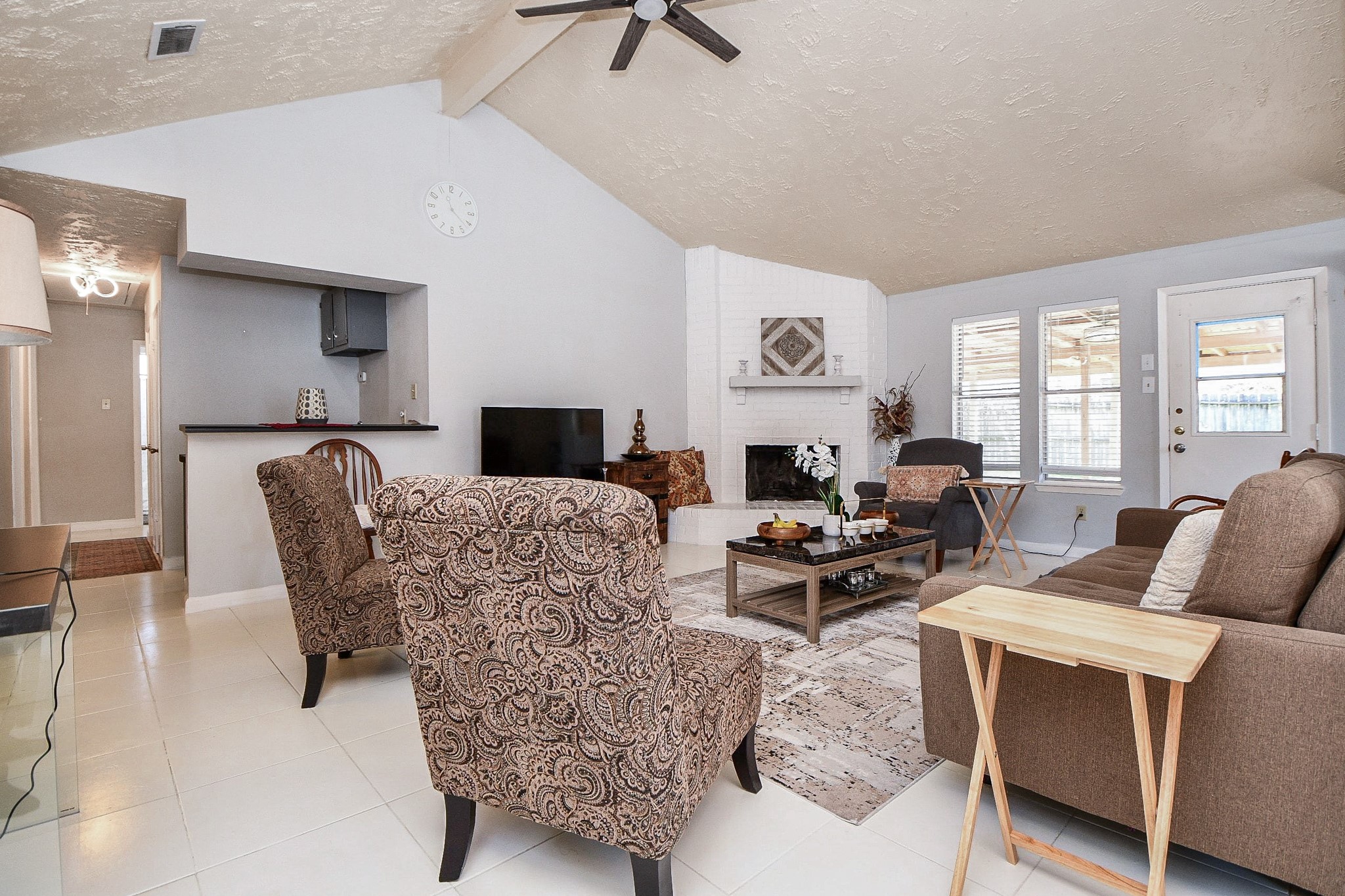 16711 Ribbonridge Drive Sugar Land, TX 77498 - Photo 8 of 24 a living room with furniture a large window and a table