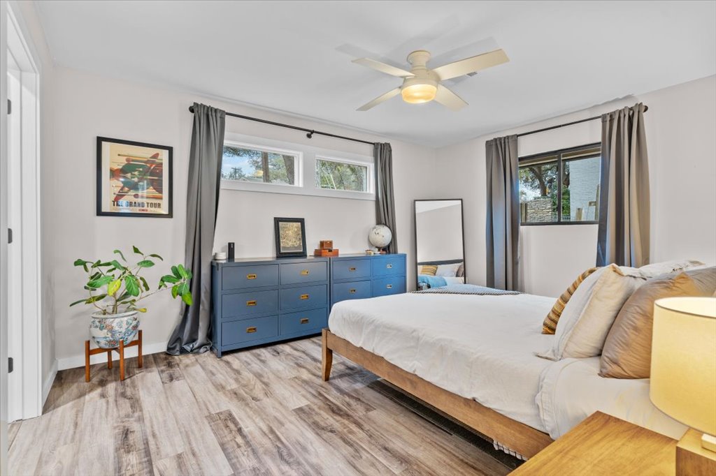 3010 Burleson Road, Unit A Austin, TX 78741 - Photo 15 of 28 Bedroom with light wood-style flooring and a ceiling fan