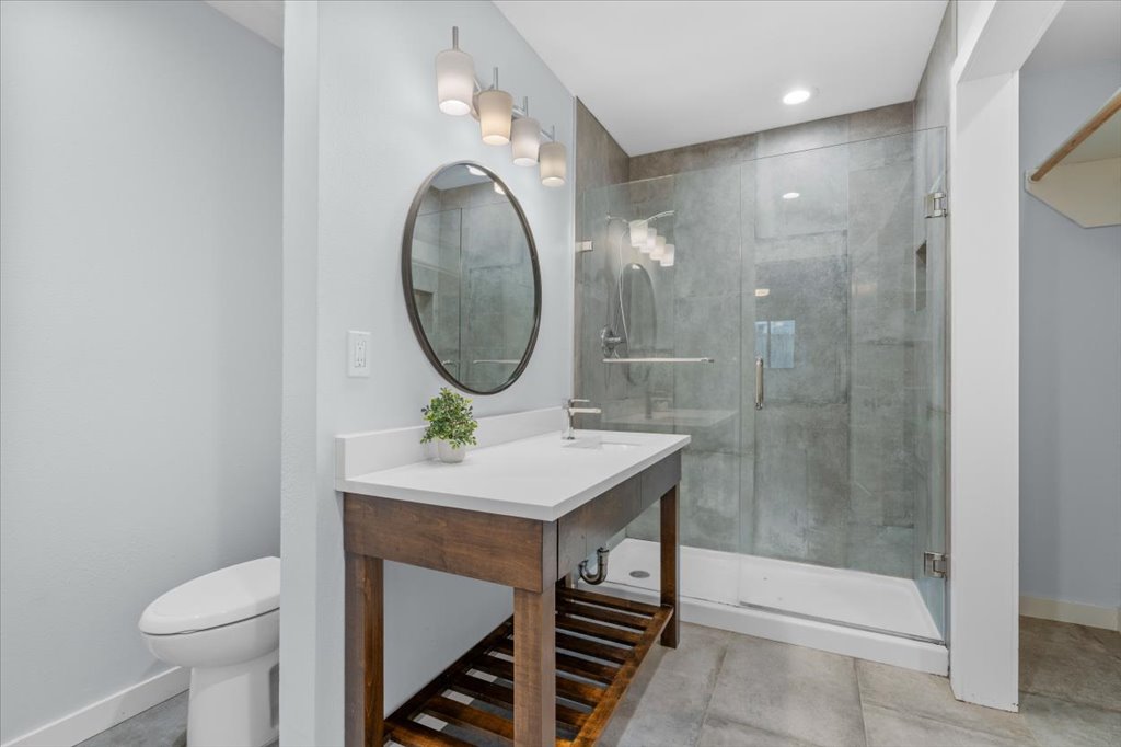 3010 Burleson Road, Unit A Austin, TX 78741 - Photo 17 of 28 Full bath with vanity, a stall shower, and recessed lighting