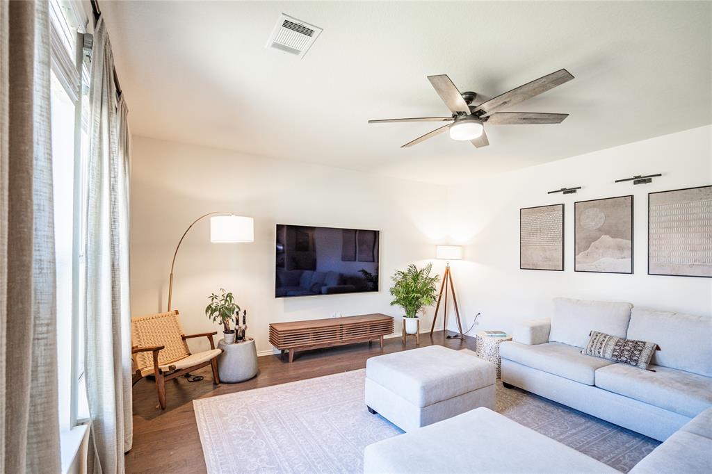 547 Saturnia Drive Georgetown, TX 78628 - Photo 18 of 39 a living room with furniture and a flat screen tv