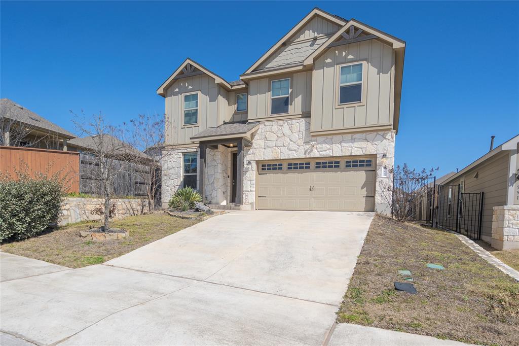 547 Saturnia Drive Georgetown, TX 78628 - Photo 2 of 39 a front view of a house with a yard and garage