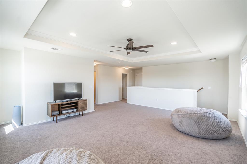 547 Saturnia Drive Georgetown, TX 78628 - Photo 22 of 39 a living room with furniture and a flat screen tv