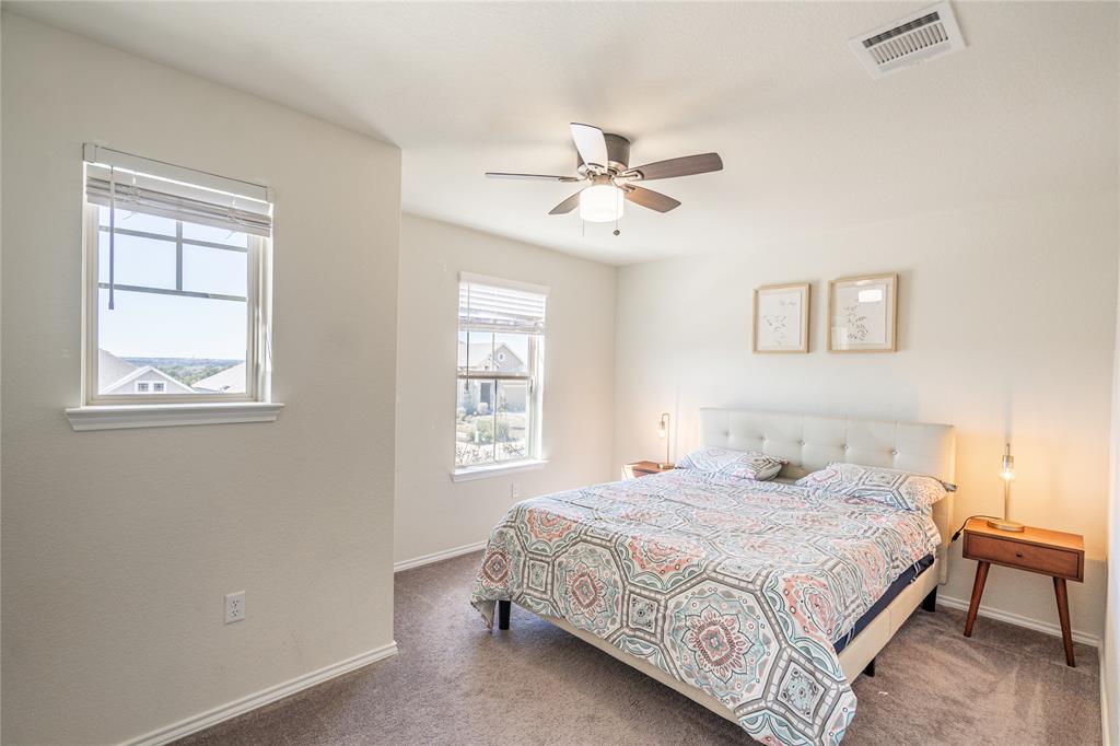 547 Saturnia Drive Georgetown, TX 78628 - Photo 23 of 39 a bedroom with a bed and a window