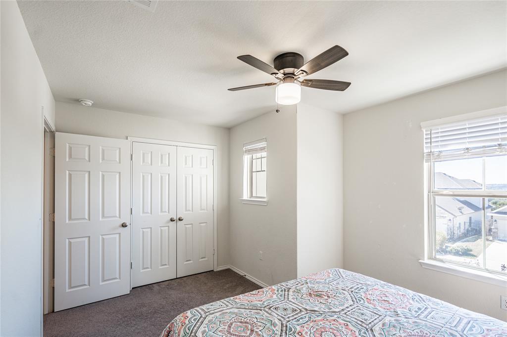 547 Saturnia Drive Georgetown, TX 78628 - Photo 24 of 39 a bedroom with a large bed and a window