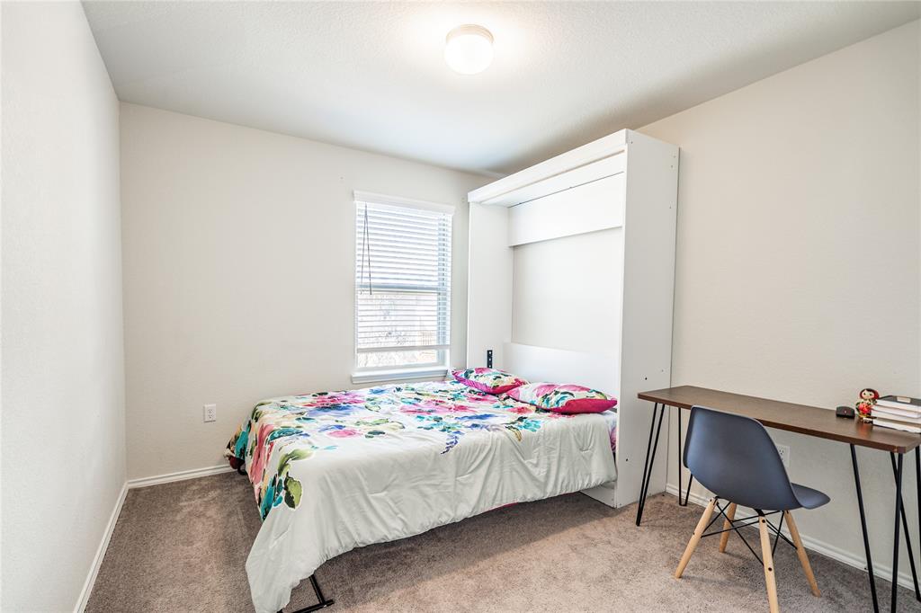 547 Saturnia Drive Georgetown, TX 78628 - Photo 31 of 39 a bedroom with a bed and a window