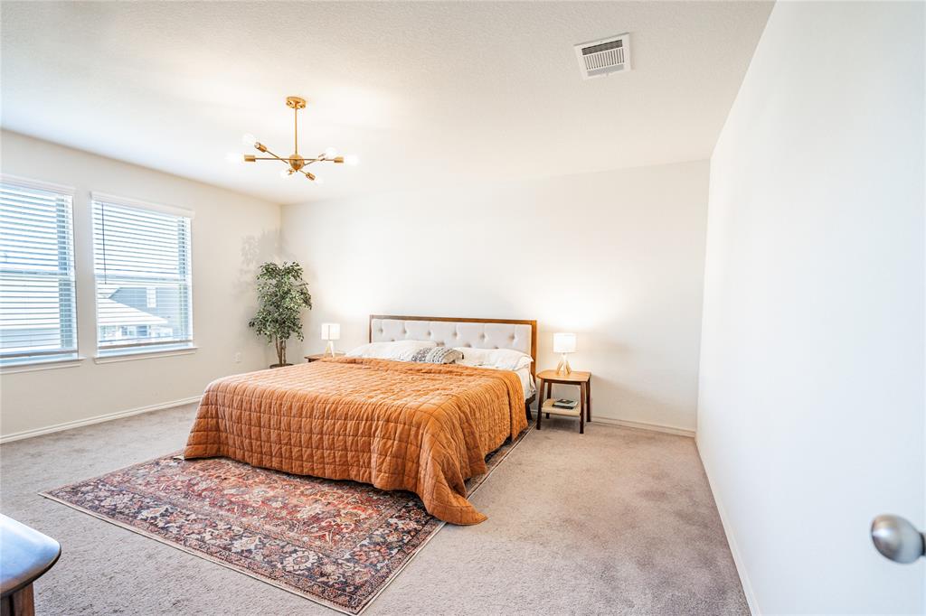 547 Saturnia Drive Georgetown, TX 78628 - Photo 33 of 39 a bedroom with a large bed and a window