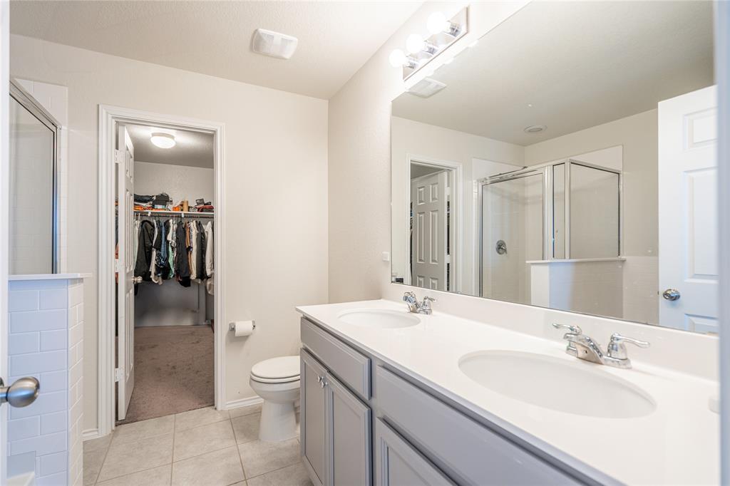 547 Saturnia Drive Georgetown, TX 78628 - Photo 35 of 39 a bathroom with a sink a toilet and shower