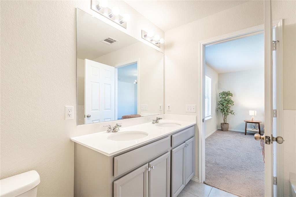 547 Saturnia Drive Georgetown, TX 78628 - Photo 39 of 39 a bathroom with a sink and a mirror