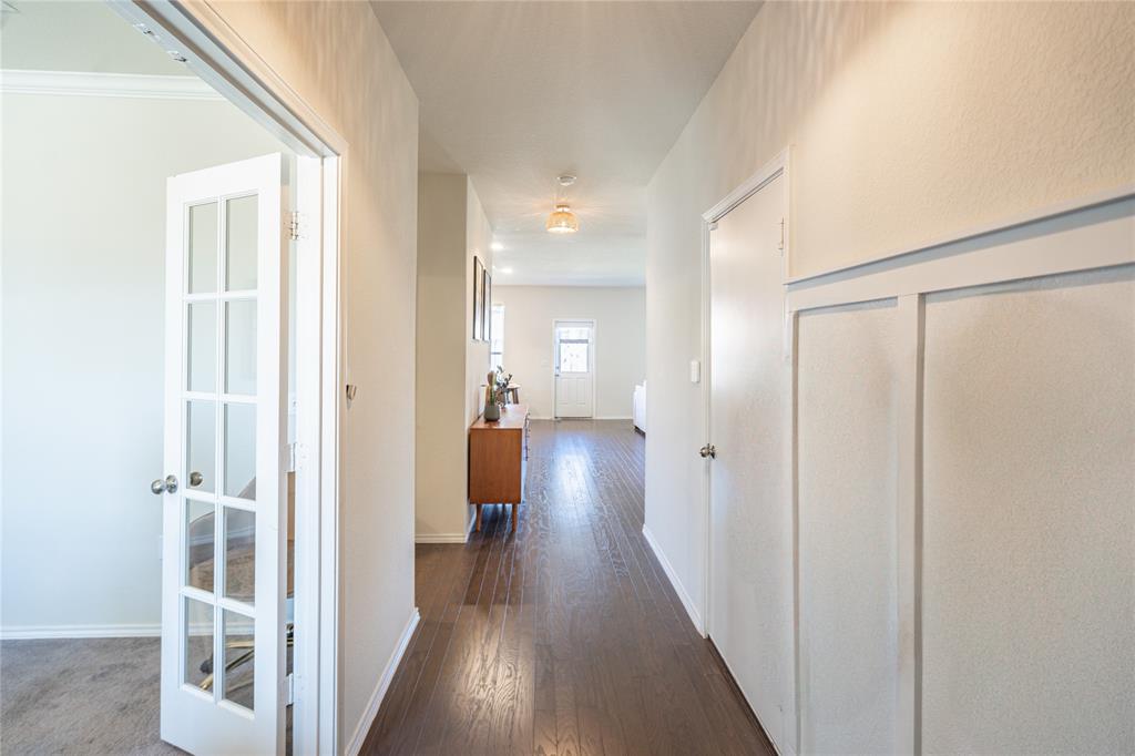 547 Saturnia Drive Georgetown, TX 78628 - Photo 5 of 39 a view of a hallway with a wooden floors