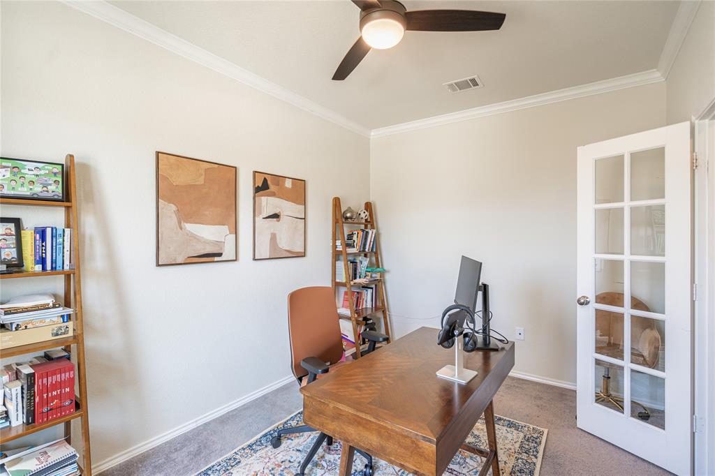 547 Saturnia Drive Georgetown, TX 78628 - Photo 8 of 39 a view of a workspace with furniture and toys