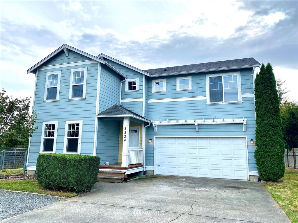3224 Locust Avenue Bellingham, WA 98225 - Photo 1 of 28 a front view of a house with garage