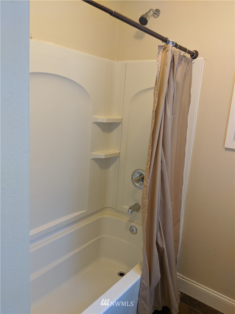3224 Locust Avenue Bellingham, WA 98225 - Photo 12 of 28 a bathroom with a shower and a bath tub