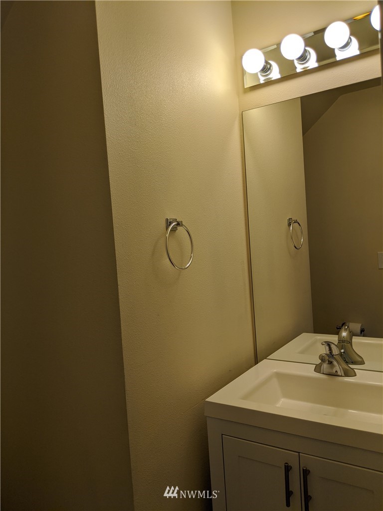 3224 Locust Avenue Bellingham, WA 98225 - Photo 14 of 28 a bathroom with a sink and mirror