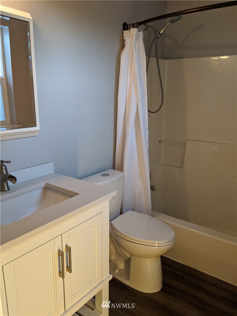 3224 Locust Avenue Bellingham, WA 98225 - Photo 16 of 28 a bathroom with a sink a toilet and shower