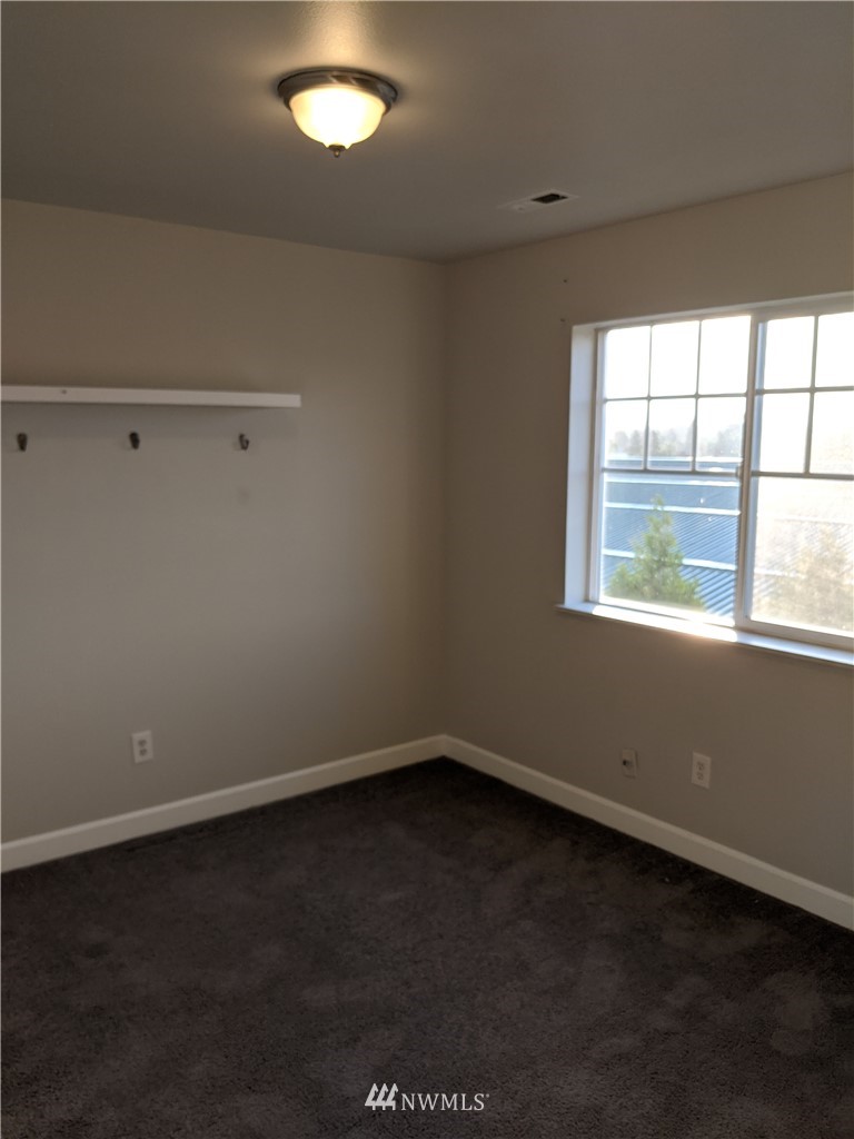 3224 Locust Avenue Bellingham, WA 98225 - Photo 21 of 28 an empty room with a window