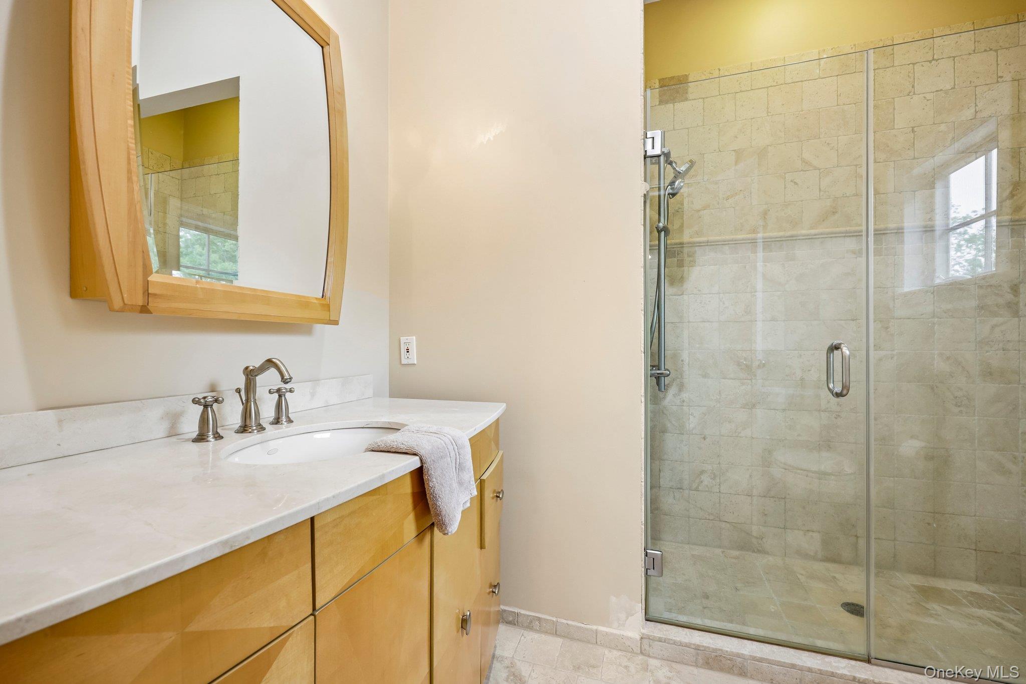 5 Mill Road Lloyd Harbor, NY 11743 - Photo 30 of 49 a bathroom with a granite countertop sink a mirror and a shower