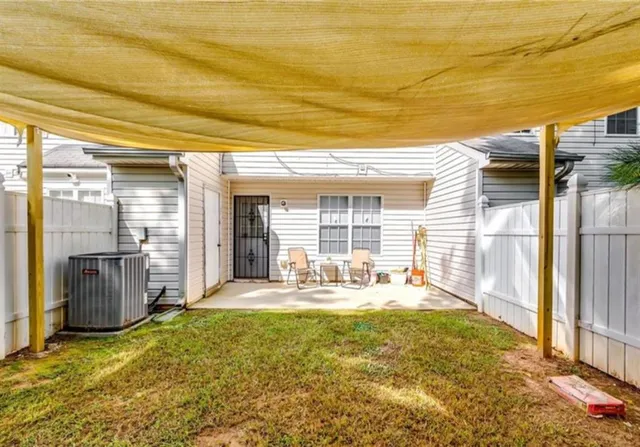 a house view with swimming pool in front of it