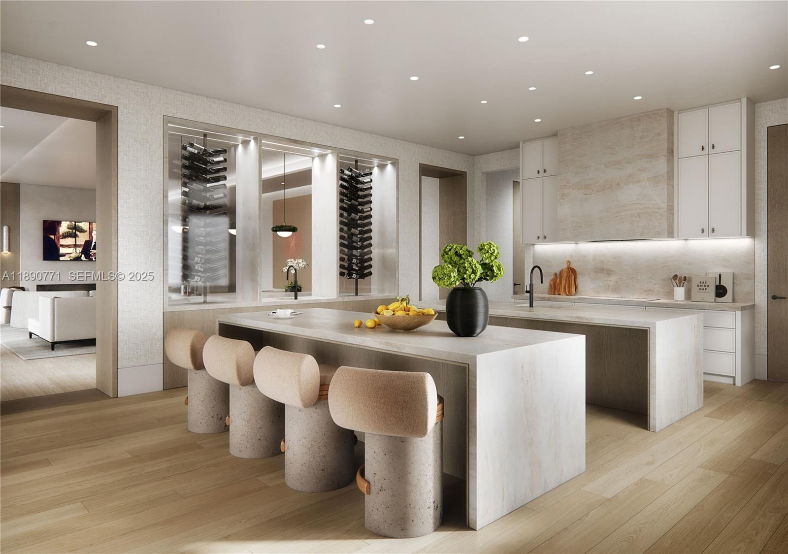 1003 Fisher Island Drive Miami Beach, FL 33109 - Photo 5 of 29 a large white dining hall with stainless steel appliances kitchen island granite countertop a dining table chairs and a large window