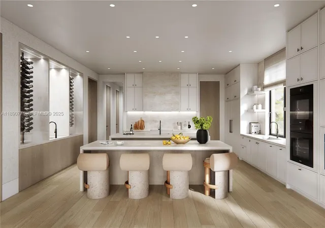 a kitchen with stainless steel appliances kitchen island granite countertop a sink and wooden floors
