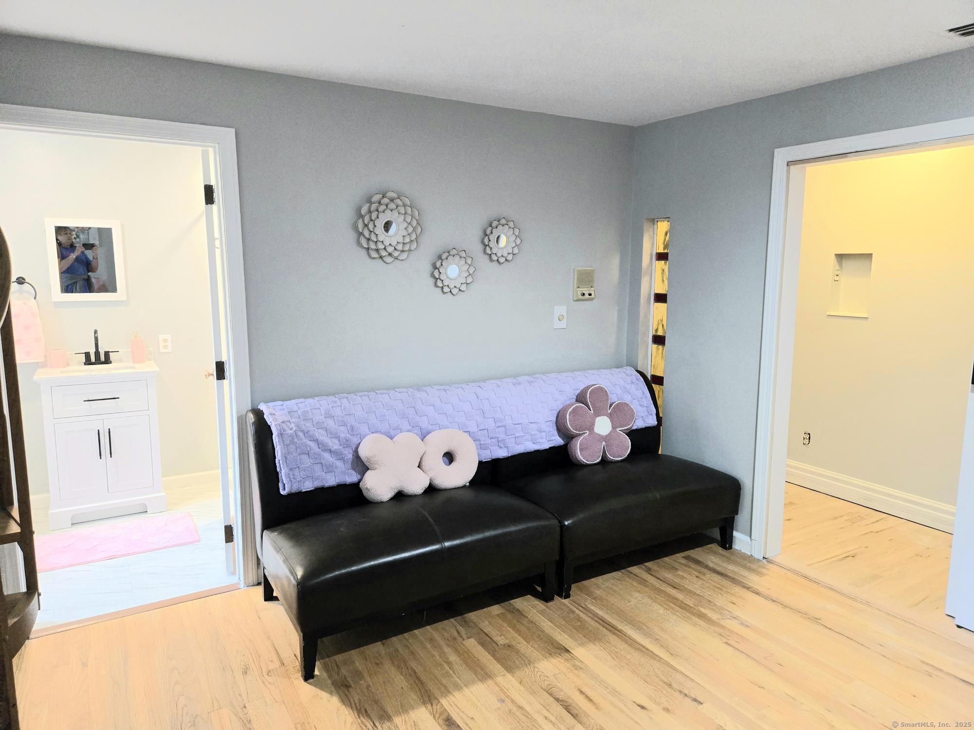 297 Wickham Road Glastonbury, CT 06033 - Photo 19 of 39 a bedroom with furniture and wooden floor