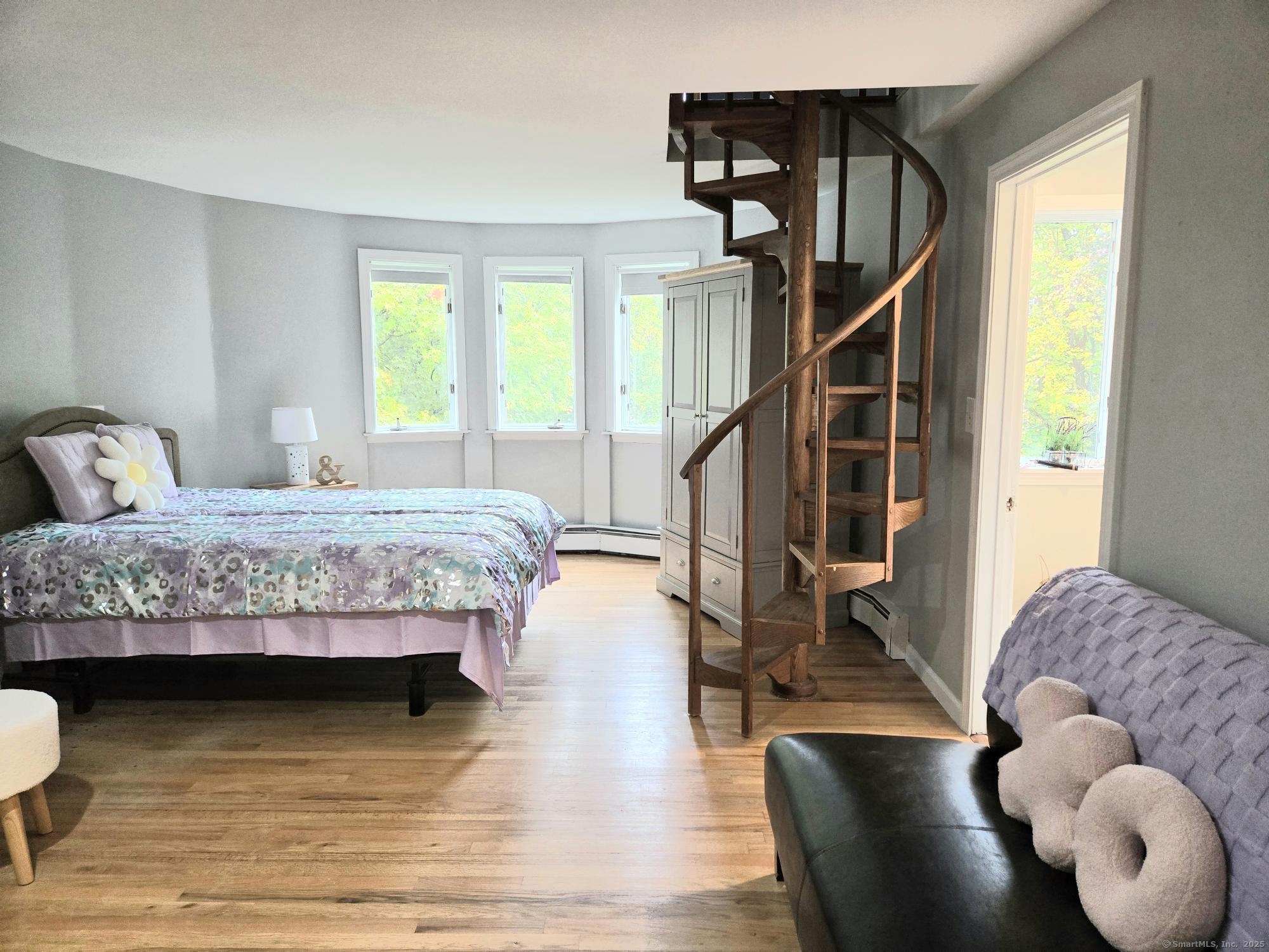 297 Wickham Road Glastonbury, CT 06033 - Photo 20 of 39 a bedroom with a bed and window