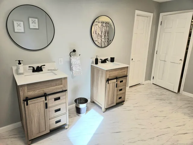 a bathroom with a bathtub and shower