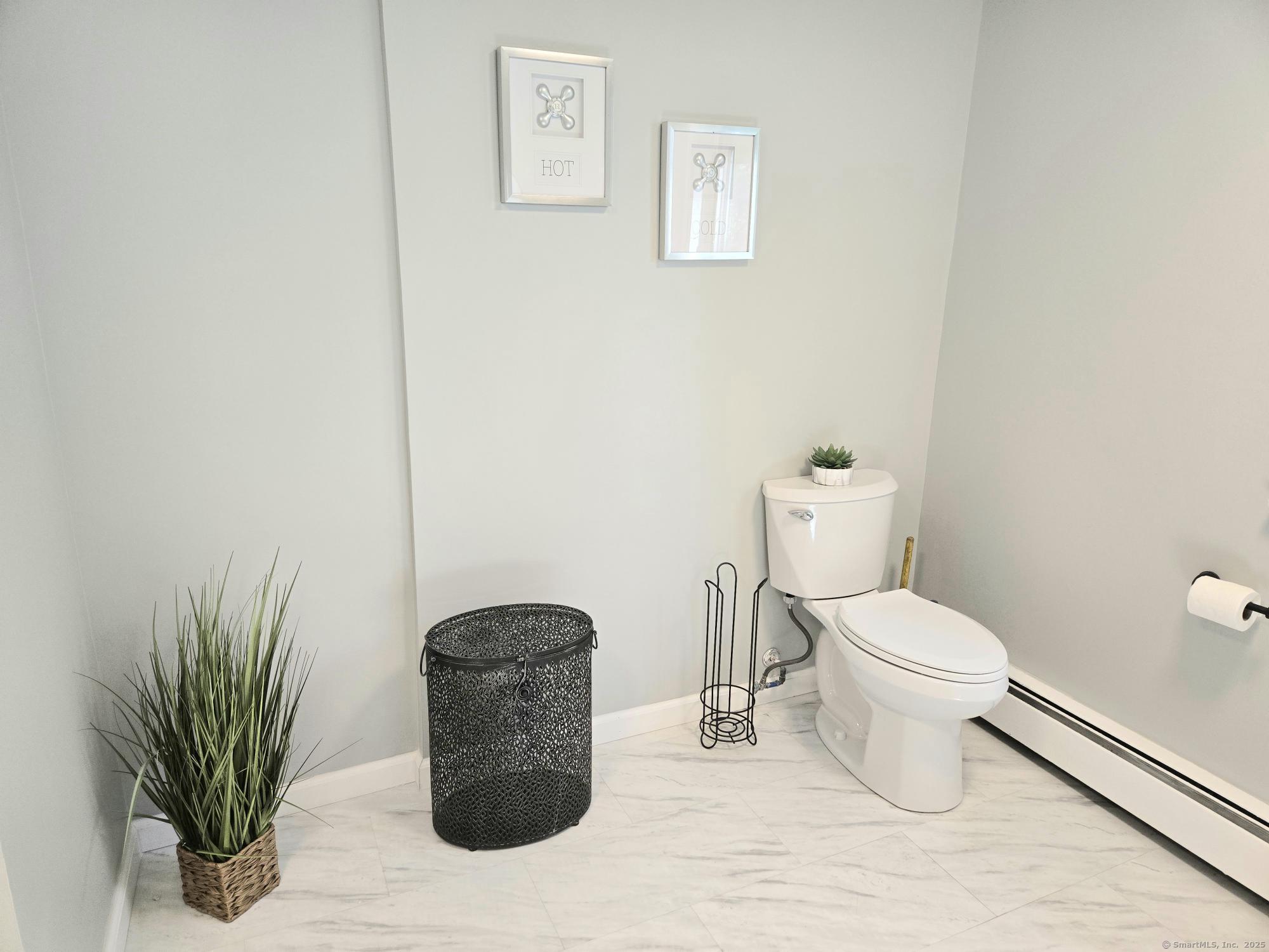 297 Wickham Road Glastonbury, CT 06033 - Photo 25 of 39 a bathroom with a toilet and a shower