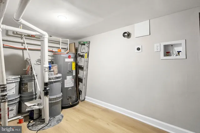 a view of a house with a tree in the background
