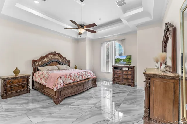 a bedroom with a bed dresser and a chair