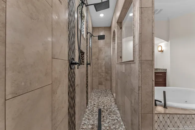 a bathroom with a glass shower door
