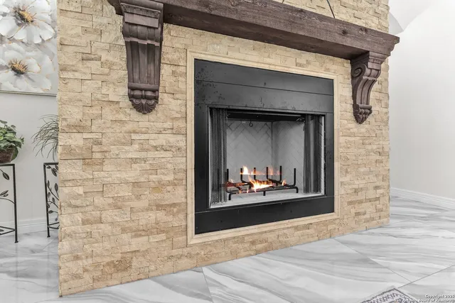 a stone house with a fireplace