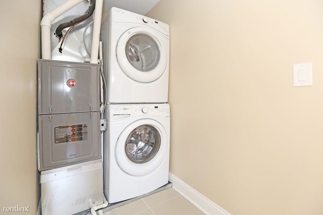 Undisclosed Address Chicago, IL 60622 - Photo 11 of 13 a utility room with dryer and washer
