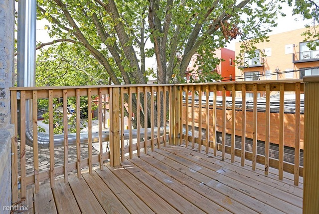 Undisclosed Address Chicago, IL 60622 - Photo 12 of 13 a view of a balcony with wooden floor