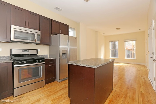 Undisclosed Address Chicago, IL 60622 - Photo 4 of 13 a kitchen with stainless steel appliances granite countertop a stove a refrigerator and a microwave