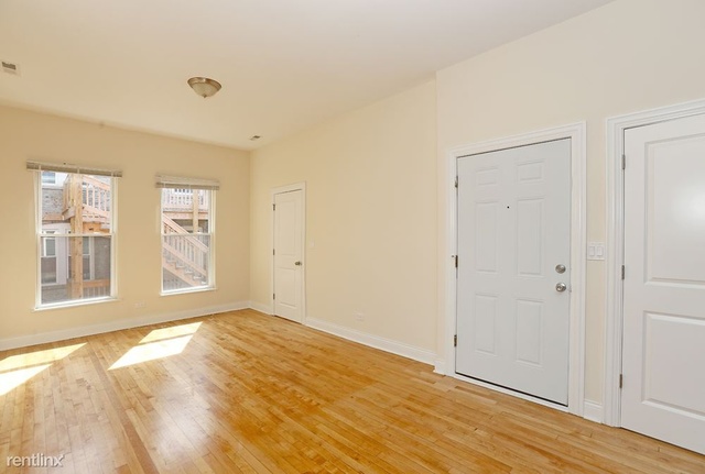Undisclosed Address Chicago, IL 60622 - Photo 5 of 13 a view of empty room with wooden floor and fan