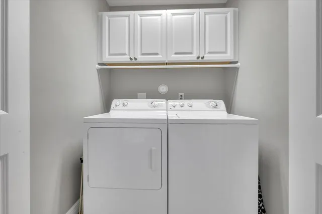 a bathroom with a sink vanity mirror and toilet